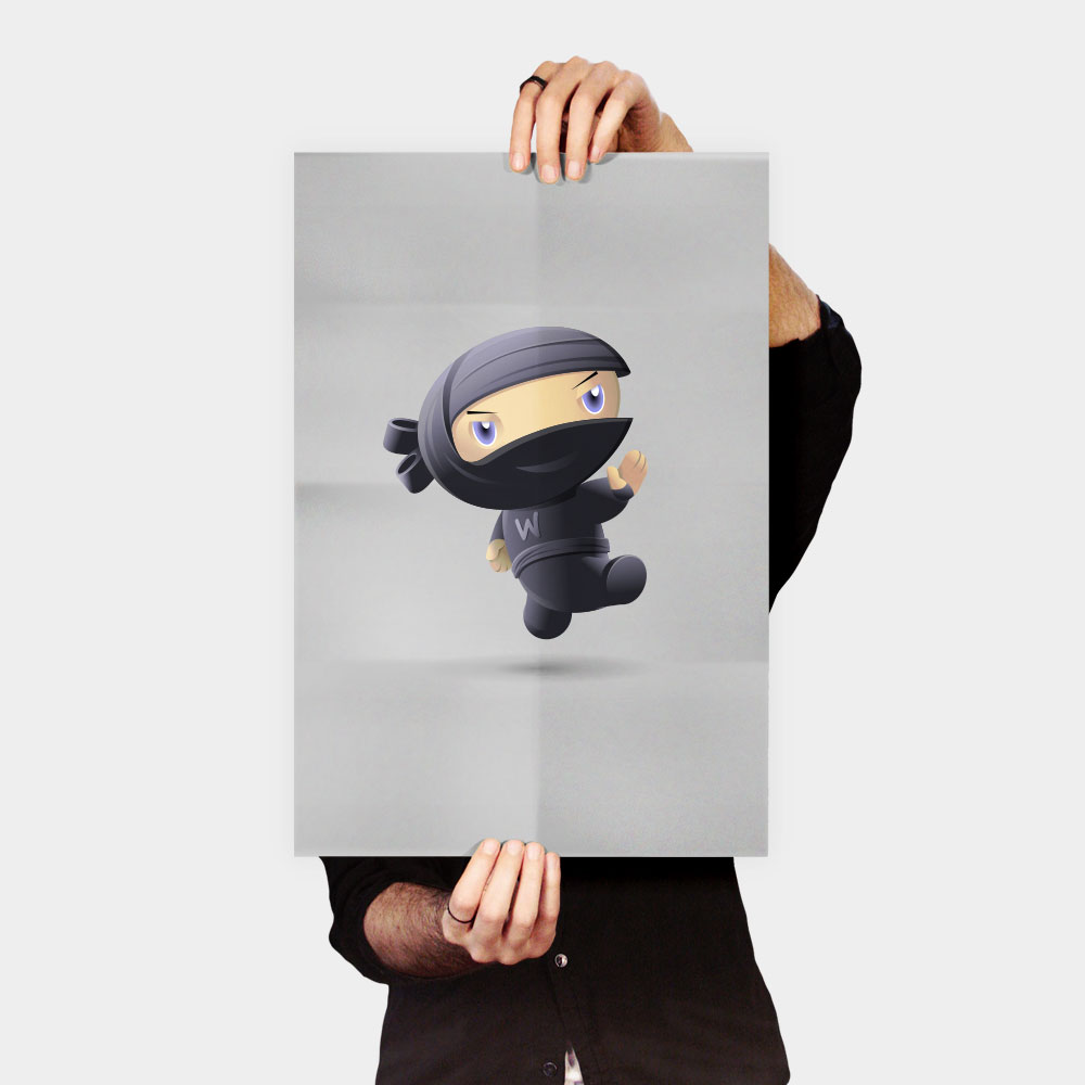 Person holding a poster of cartoon ninja.