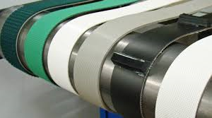 Close-up of industrial conveyor belts in a factory setting.
