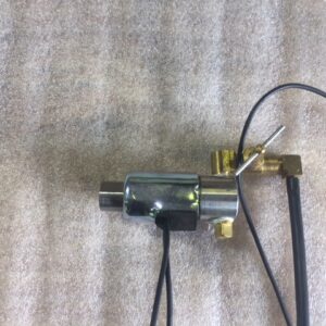 A small mechanical component with attached wires and connectors.