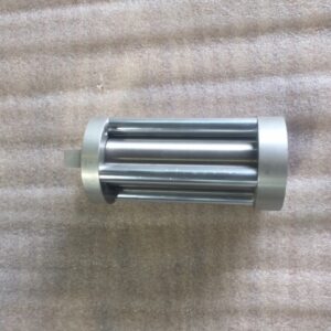 A silver cylindrical metal object with multiple vertical rods.