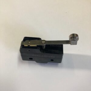 Close-up of a small mechanical component with a lever arm.