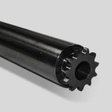 Close-up of a black cylindrical gear shaft with a toothed end.