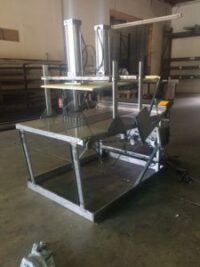 Industrial machine in a workshop setting.